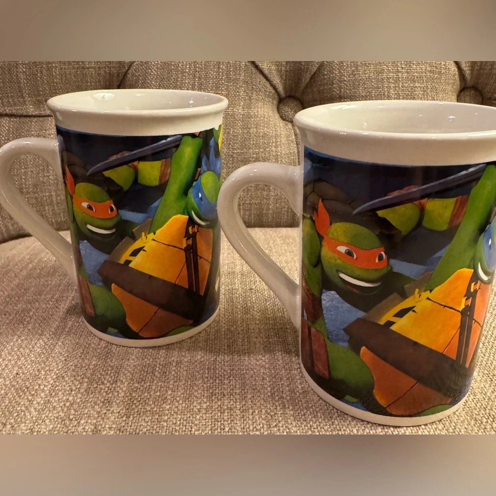 2 Teenage Mutant Ninja Turtles (TMNT) ceramic mugs perfect for hot coco.